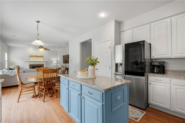 6412 Interlaken Dr, South Fayette, PA 15057 - kitchen with stainless steel refrigerator with ice dispenser, blue cabinetry, white cabinets, and recessed lighting