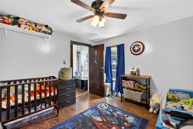 3879 Pittsburgh Rd, Perry Twp Fay, PA 15473 - bedroom featuring radiator heating unit, wood finished floors, and a ceiling fan