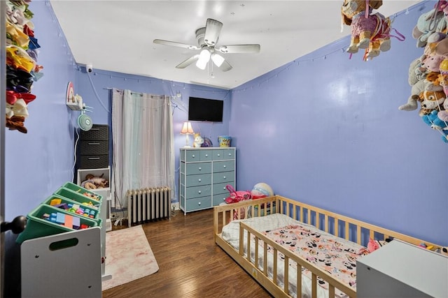 3879 Pittsburgh Rd, Perry Twp Fay, PA 15473 - bedroom featuring radiator, wood finished floors, and ceiling fan