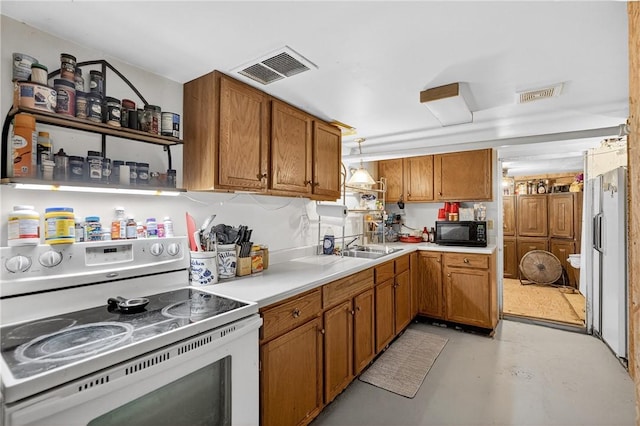 3879 Pittsburgh Rd, Perry Twp Fay, PA 15473 - kitchen featuring white electric stove, black microwave, and brown cabinets