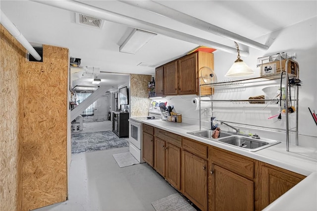 3879 Pittsburgh Rd, Perry Twp Fay, PA 15473 - kitchen with white electric stove, concrete floors, light countertops, pendant lighting, and brown cabinets
