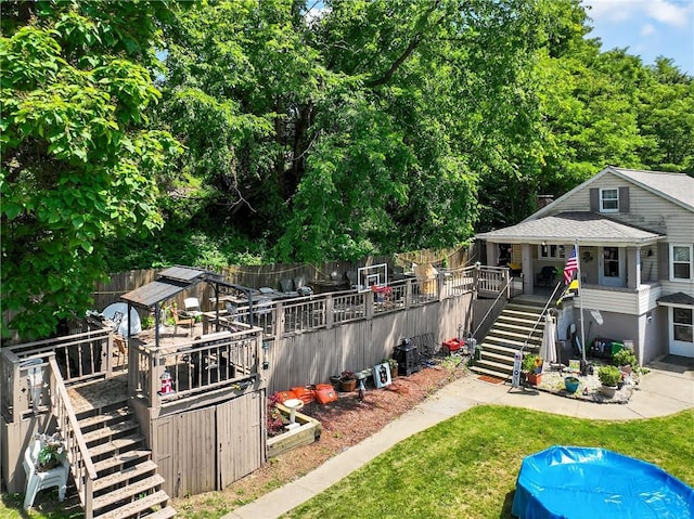 3879 Pittsburgh Rd, Perry Twp Fay, PA 15473 - fenced backyard with stairs and a wooden deck