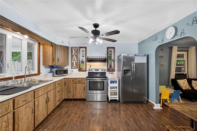 3879 Pittsburgh Rd, Perry Twp Fay, PA 15473 - kitchen with stainless steel appliances, exhaust hood, light countertops, and arched walkways