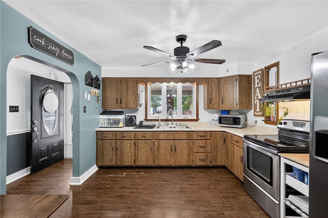 3879 Pittsburgh Rd, Perry Twp Fay, PA 15473 - kitchen with stainless steel appliances, light countertops, under cabinet range hood, arched walkways, and a ceiling fan