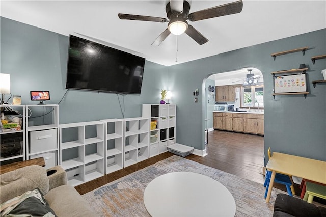 3879 Pittsburgh Rd, Perry Twp Fay, PA 15473 - living area with a ceiling fan, wood finished floors, and arched walkways