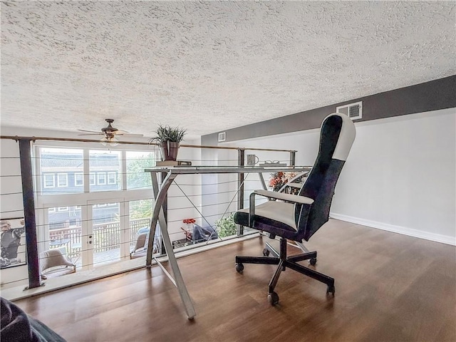 66 Pius St Unit 103, South Side, PA 15203 - living area featuring wood finished floors, a textured ceiling, and ceiling fan