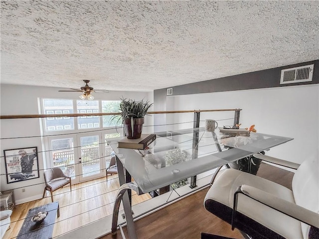 66 Pius St Unit 103, South Side, PA 15203 - interior space featuring a textured ceiling, a ceiling fan, and wood finished floors