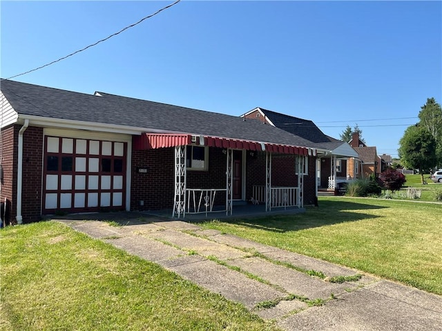 2103 Vermont Ave, West Mifflin, PA 15122 - single story home with an attached garage, a porch, brick siding, a front lawn, and driveway