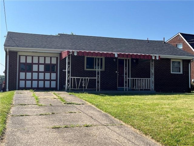 2103 Vermont Ave, West Mifflin, PA 15122 - view of front facade featuring brick siding, an attached garage, a front yard, driveway, and a porch