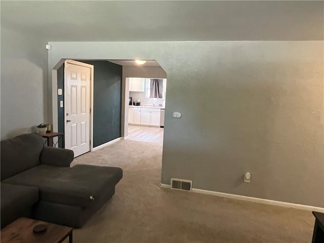 2103 Vermont Ave, West Mifflin, PA 15122 - living room featuring light colored carpet and baseboards