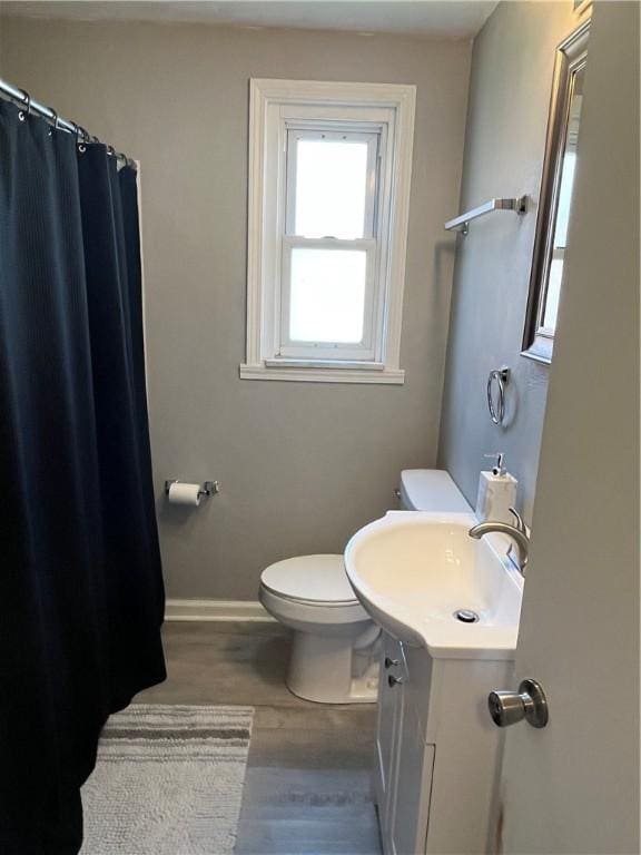 2103 Vermont Ave, West Mifflin, PA 15122 - full bathroom with vanity, a shower with curtain, and wood finished floors