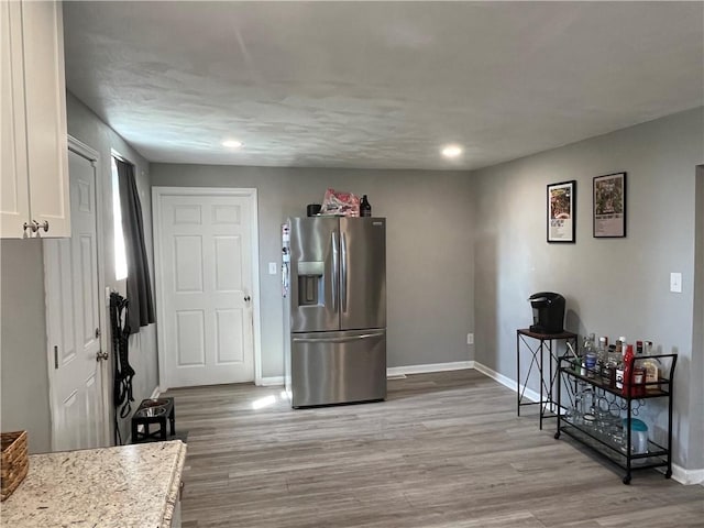 2103 Vermont Ave, West Mifflin, PA 15122 - kitchen with stainless steel refrigerator with ice dispenser, white cabinetry, light wood-type flooring, and recessed lighting