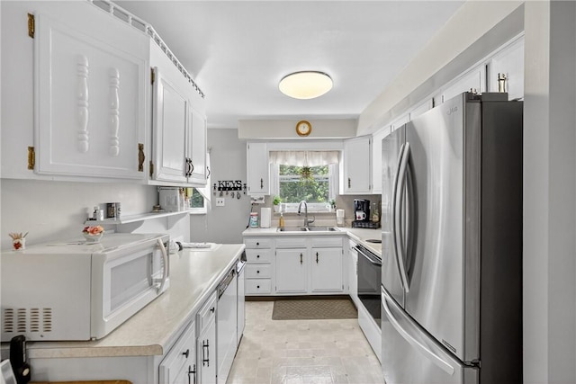 468 Crest Dr, Delmont, PA 15626 - kitchen with stainless steel appliances, light countertops, and white cabinets