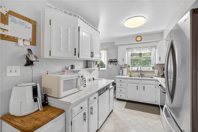 468 Crest Dr, Delmont, PA 15626 - kitchen with white appliances, white cabinets, light countertops, and light floors
