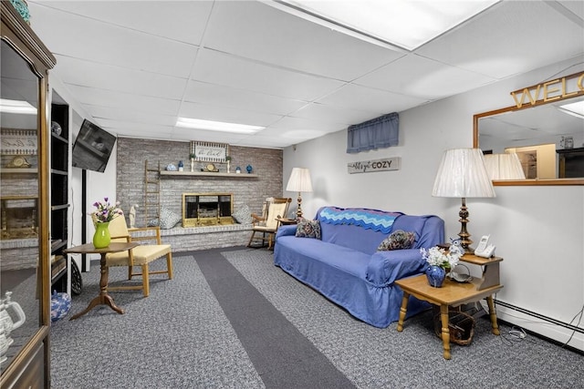 468 Crest Dr, Delmont, PA 15626 - carpeted living area featuring a drop ceiling, a baseboard radiator, and a brick fireplace