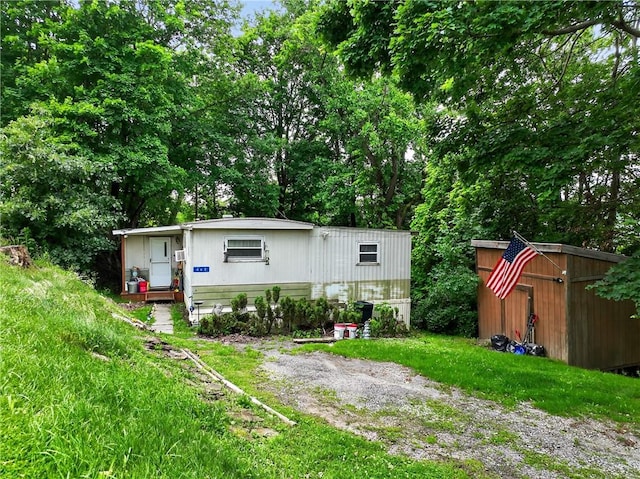 468 Crest Dr, Delmont, PA 15626 - view of front of property featuring a shed and a wall mounted AC