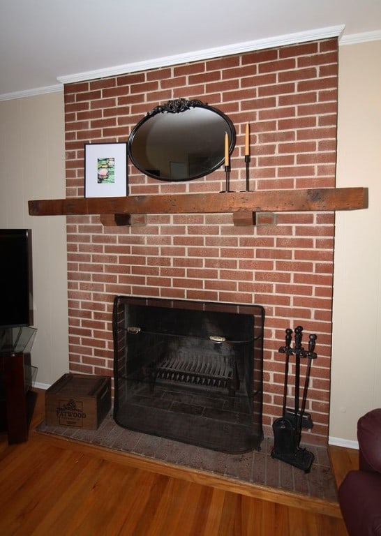 1351 Sky Ridge Dr, Upper St Clair, PA 15241 - detailed view of a brick fireplace, wood finished floors, and crown molding