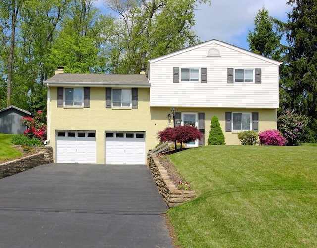 1351 Sky Ridge Dr, Upper St Clair, PA 15241 - tri-level home with asphalt driveway, a chimney, a garage, and a front yard