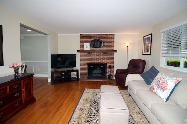 1351 Sky Ridge Dr, Upper St Clair, PA 15241 - living area with wood finished floors, a fireplace, ornamental molding, and a wainscoted wall