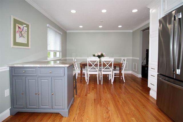 1351 Sky Ridge Dr, Upper St Clair, PA 15241 - kitchen with freestanding refrigerator, white cabinets, light wood-type flooring, light countertops, and recessed lighting