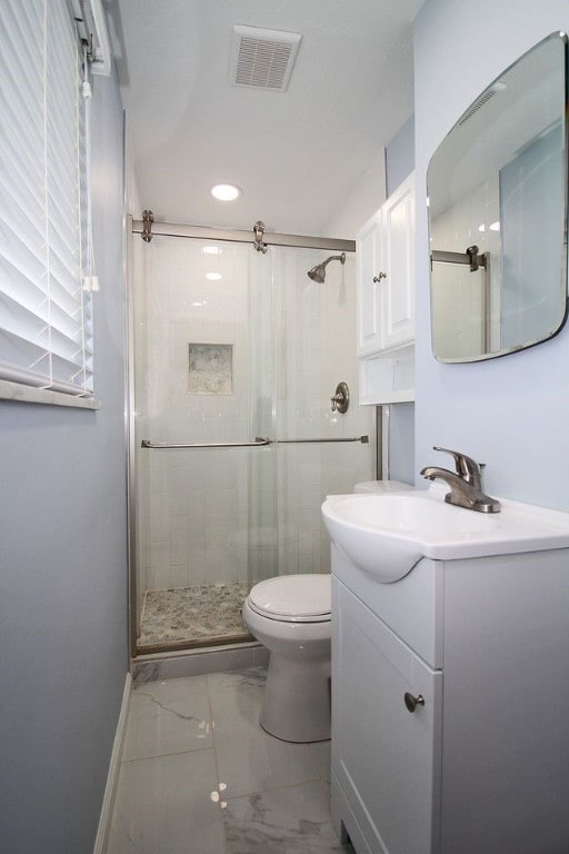 1351 Sky Ridge Dr, Upper St Clair, PA 15241 - bathroom featuring vanity, marble finish floors, a shower stall, and recessed lighting