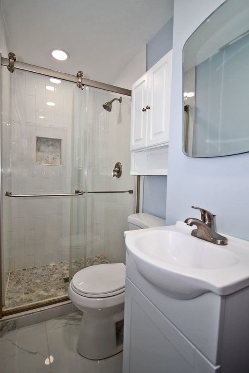 1351 Sky Ridge Dr, Upper St Clair, PA 15241 - full bath featuring marble look tiles, vanity, a shower stall, and recessed lighting