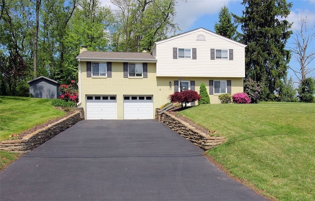 1351 Sky Ridge Dr, Upper St Clair, PA 15241 - split level home with asphalt driveway, a garage, a front lawn, and a chimney