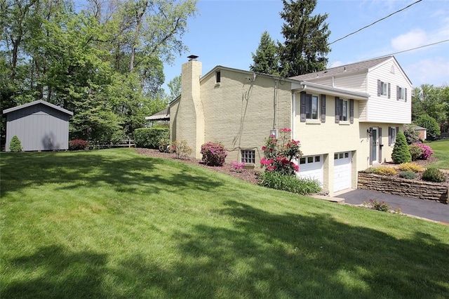 1351 Sky Ridge Dr, Upper St Clair, PA 15241 - view of property exterior with a chimney, asphalt driveway, a lawn, an attached garage, and a storage unit
