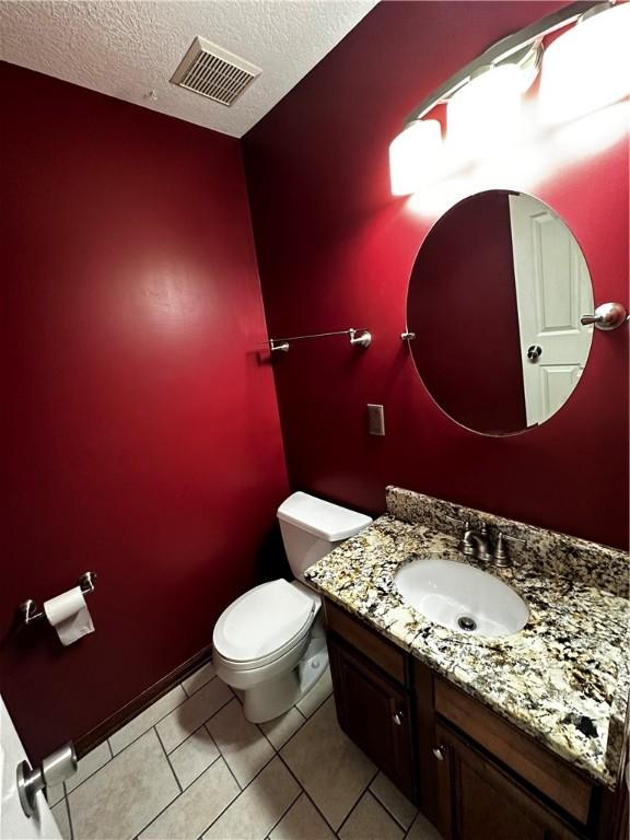 238 Cumberland Dr, Seven Fields Boro, PA 16046 - bathroom featuring vanity, a textured ceiling, and tile patterned floors