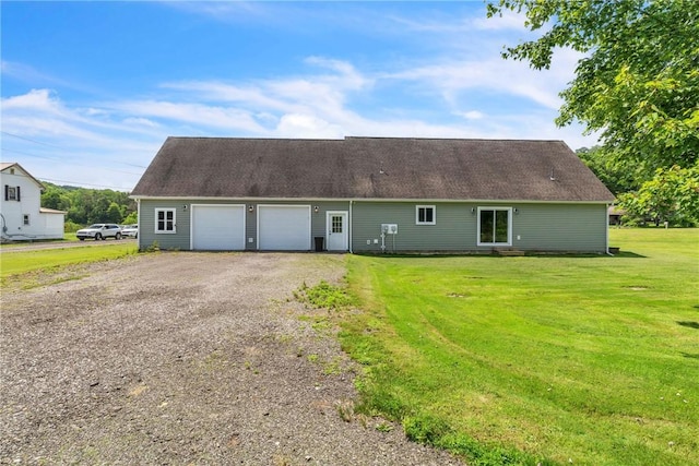 1659 Hooker Rd, Pa, PA 16041 - rear view of house with an attached garage, a yard, driveway, and entry steps