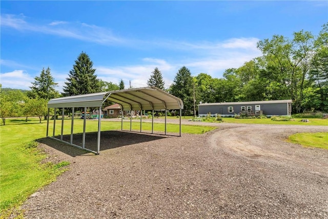 1659 Hooker Rd, Pa, PA 16041 - surrounding community with driveway, a detached carport, and a yard