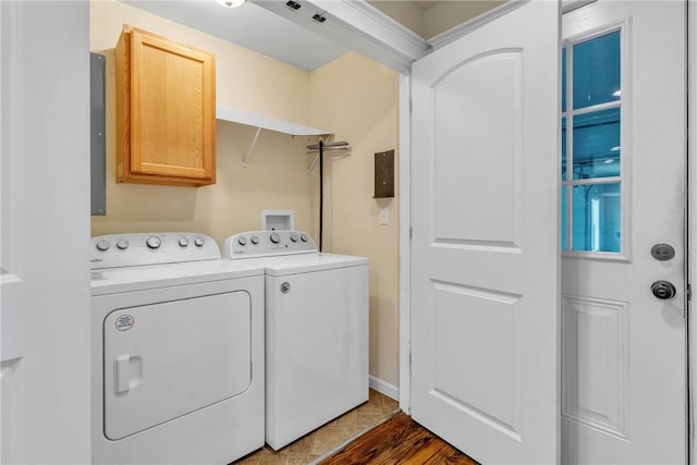 1659 Hooker Rd, Pa, PA 16041 - laundry area with cabinet space, washer and dryer, and wood finished floors