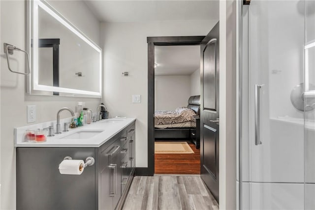 1659 Hooker Rd, Pa, PA 16041 - full bathroom featuring wood finished floors, double vanity, ensuite bath, and an enclosed shower