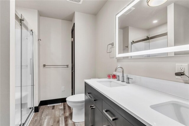 1659 Hooker Rd, Pa, PA 16041 - bathroom featuring a shower stall, double vanity, and wood finished floors