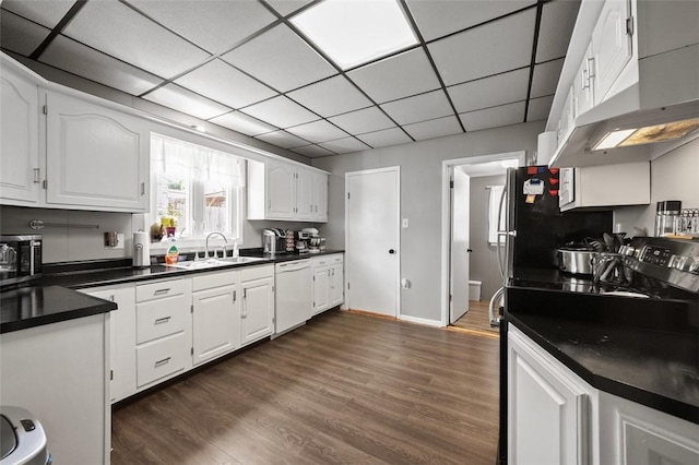 503 E Murphy Ave, Connellsville, PA 15425 - kitchen featuring dishwasher, dark countertops, stainless steel microwave, dark wood-style flooring, and a drop ceiling