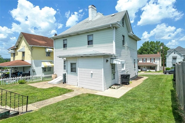 503 E Murphy Ave, Connellsville, PA 15425 - back of house with a chimney and roof with shingles