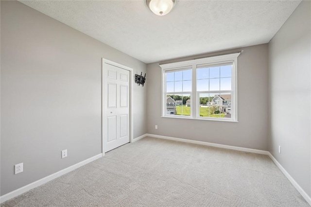108 Norfolk Dr, Buffalo Twp But, PA 16055 - unfurnished bedroom with carpet floors, a closet, and a textured ceiling