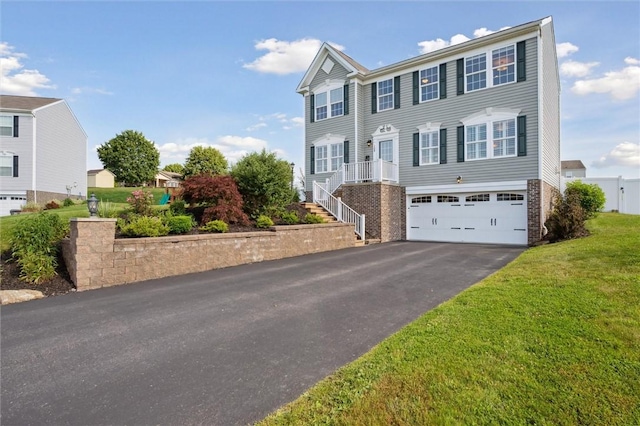 108 Norfolk Dr, Buffalo Twp But, PA 16055 - view of front facade featuring asphalt driveway, a garage, a front lawn, brick siding, and stairs