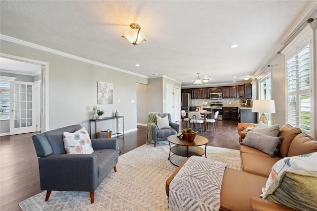 108 Norfolk Dr, Buffalo Twp But, PA 16055 - living area featuring plenty of natural light, wood finished floors, recessed lighting, and crown molding