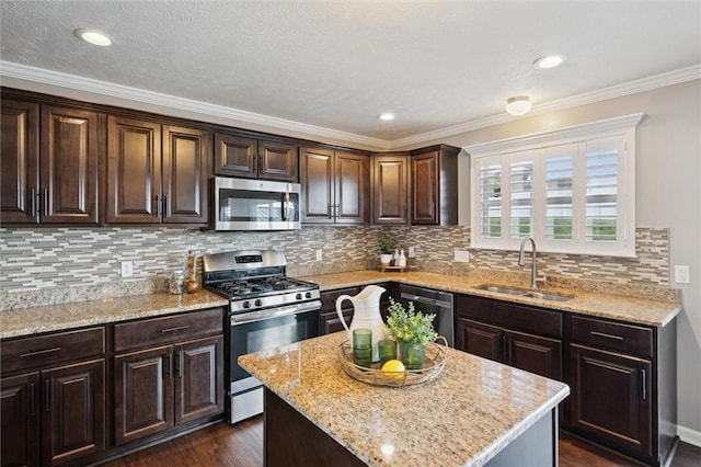 108 Norfolk Dr, Buffalo Twp But, PA 16055 - kitchen featuring appliances with stainless steel finishes, dark brown cabinets, dark wood-style floors, a kitchen island, and light stone counters