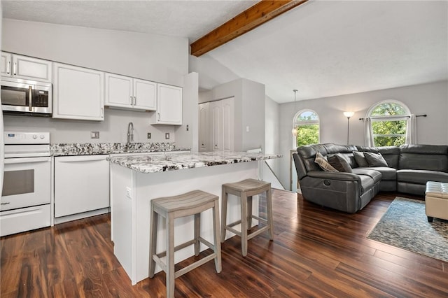 833 Glendale Ct, Cranberry Twp, PA 16066 - kitchen featuring white appliances, open floor plan, dark wood-type flooring, white cabinetry, and a kitchen bar