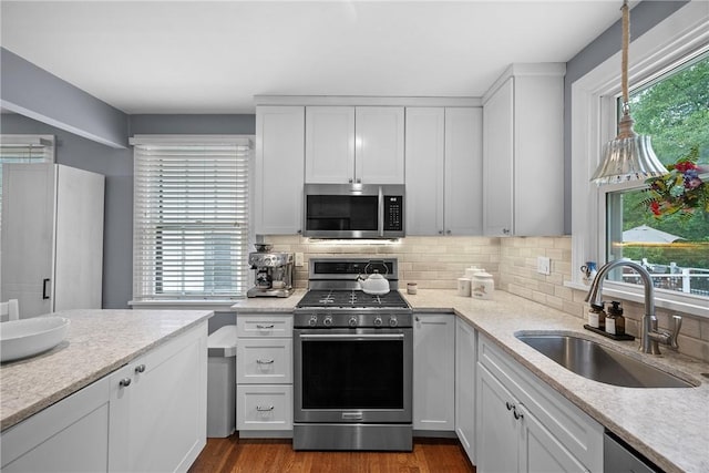 727 Vermont Ave, Mt Lebanon, PA 15234 - kitchen featuring stainless steel appliances, healthy amount of natural light, and tasteful backsplash