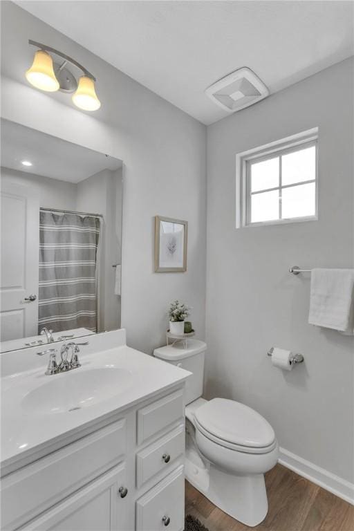 1006 Callaway Dr, Jeannette, PA 15644 - bathroom with vanity, wood finished floors, and a shower with curtain