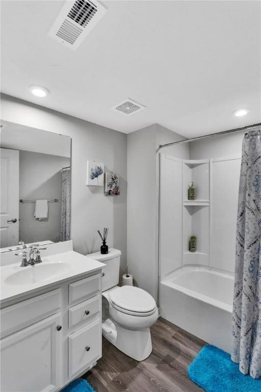 1006 Callaway Dr, Jeannette, PA 15644 - full bathroom with wood finished floors, vanity, shower / bath combo with shower curtain, and recessed lighting