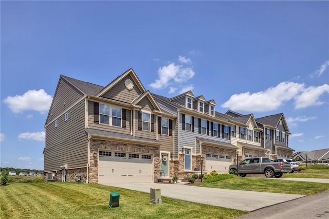 1006 Callaway Dr, Jeannette, PA 15644 - view of property with a garage, driveway, stone siding, and a front lawn
