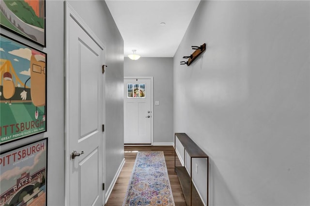 1006 Callaway Dr, Jeannette, PA 15644 - doorway to outside featuring dark wood-style floors and baseboards
