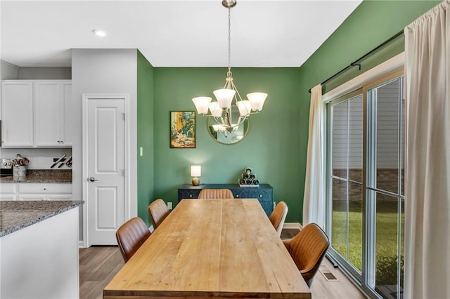 1006 Callaway Dr, Jeannette, PA 15644 - dining room with a chandelier, light wood-style flooring, and recessed lighting