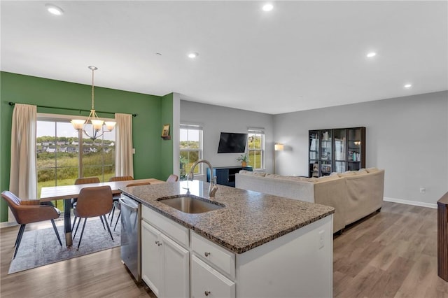 1006 Callaway Dr, Jeannette, PA 15644 - kitchen featuring dishwasher, a chandelier, light wood-style floors, white cabinets, and recessed lighting