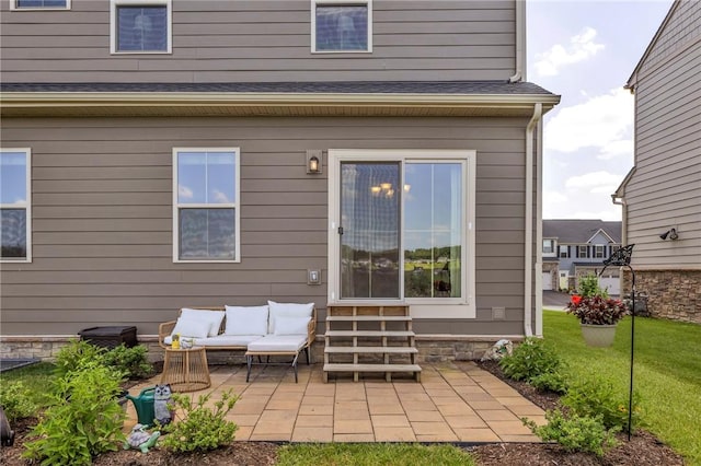 1006 Callaway Dr, Jeannette, PA 15644 - rear view of house featuring entry steps, a patio area, outdoor lounge area, and a yard