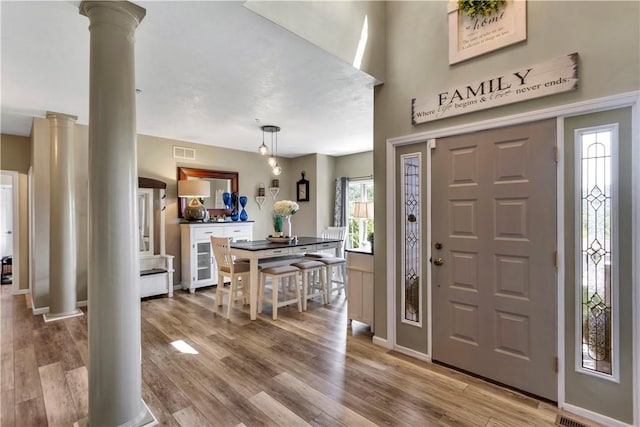 245 Shaw Ct, Salem Twp Wml, PA 15670 - foyer with decorative columns and wood finished floors